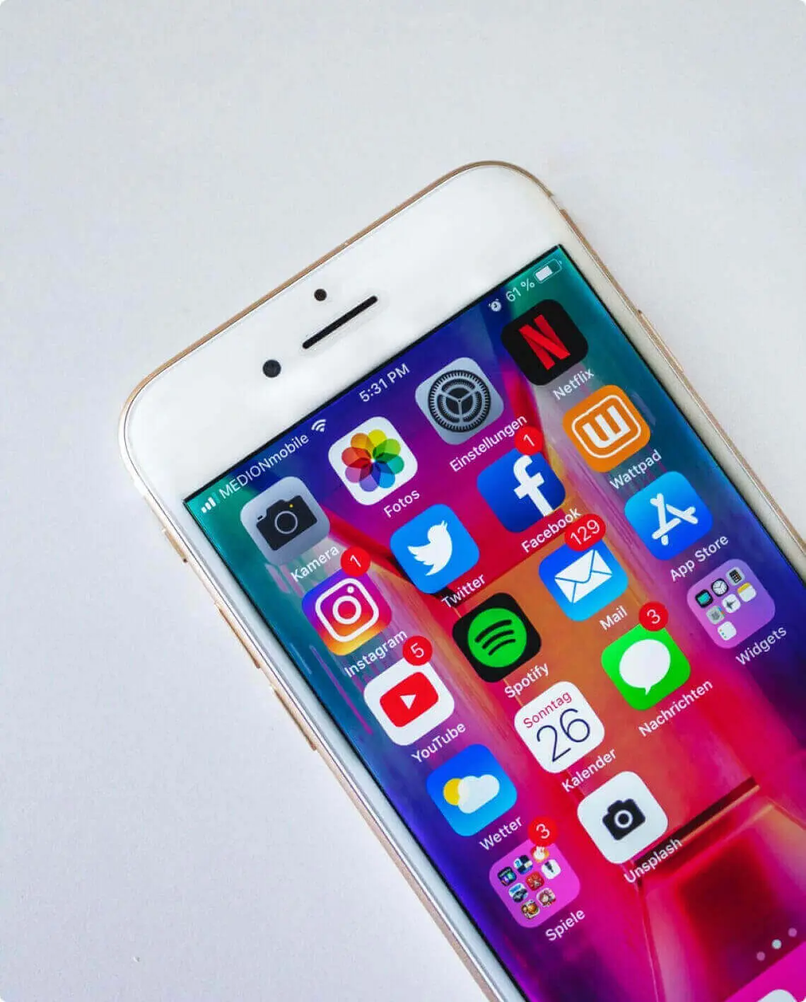 An iPhone filled with numerous apps for optimization and social media advertising.
