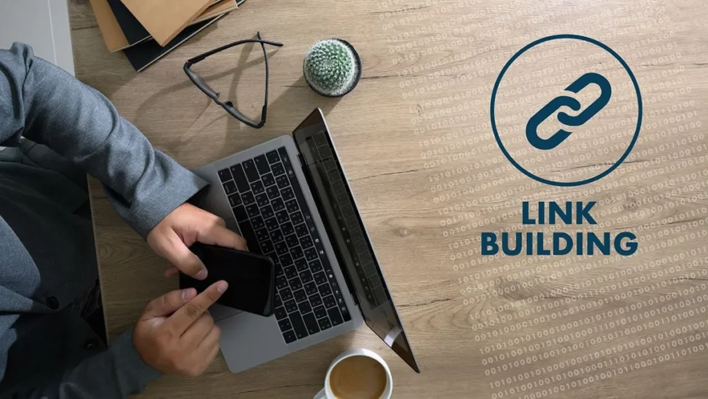 A person working on a laptop with a link building symbol, highlighting the importance of digital strategies for building a website’s authority with quality link building.