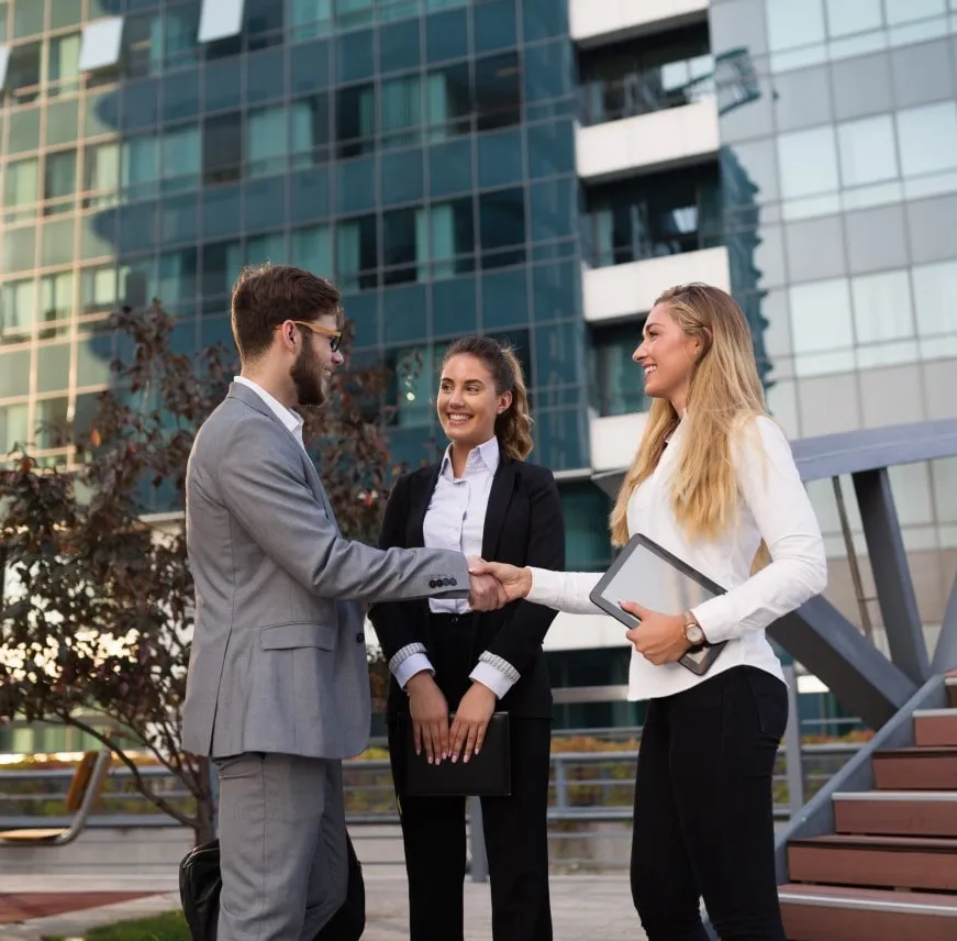 Two young businessmen using-touchpad analysis business chart document meeting