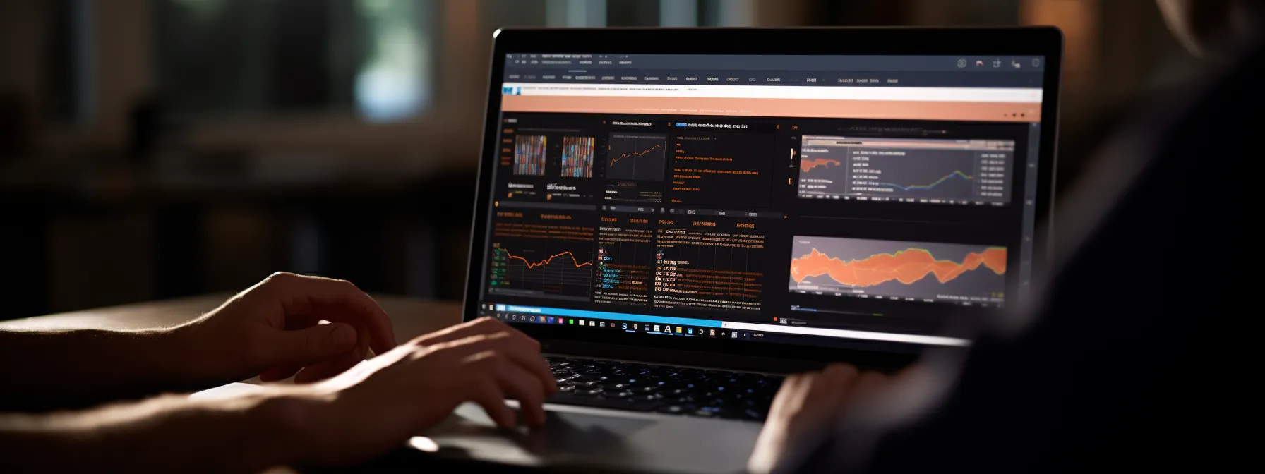 Person using a laptop displaying multiple financial charts and data dashboards in a dark-themed interface.