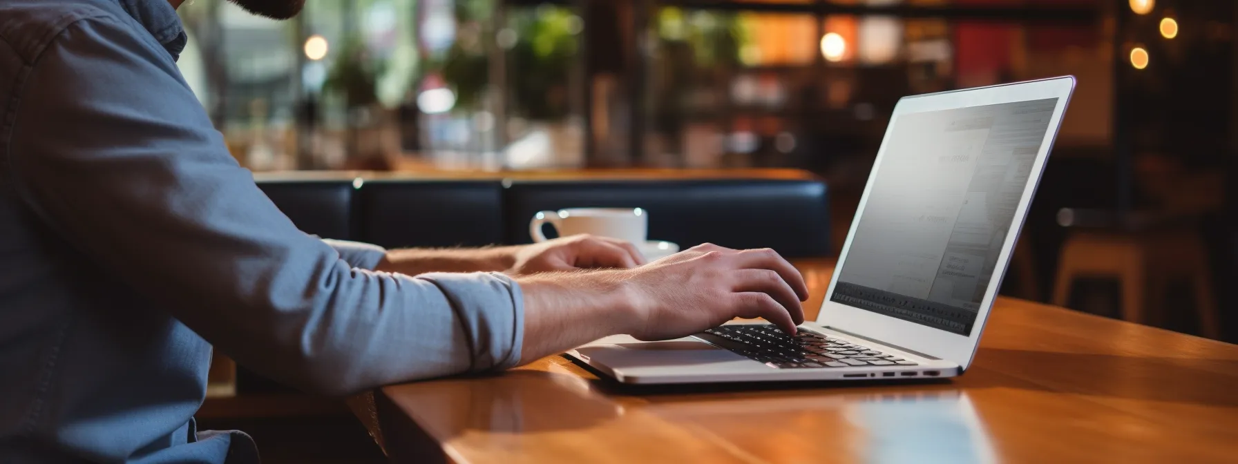 a person typing on a laptop while browsing through a list of industry-aligned websites for guest post opportunities.