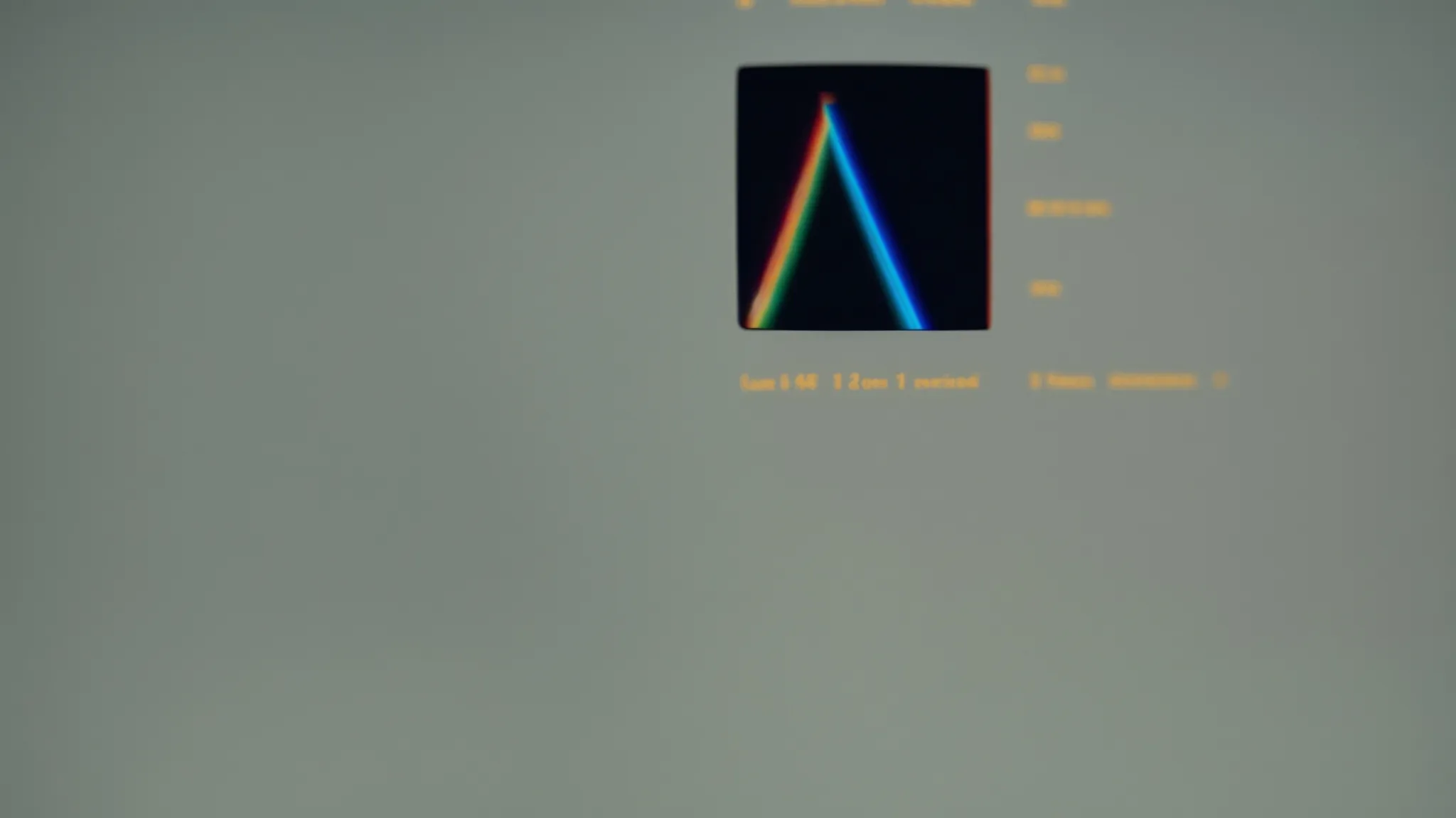 a close-up of a magnifying glass focusing on a computer screen displaying a colorful bar graph.