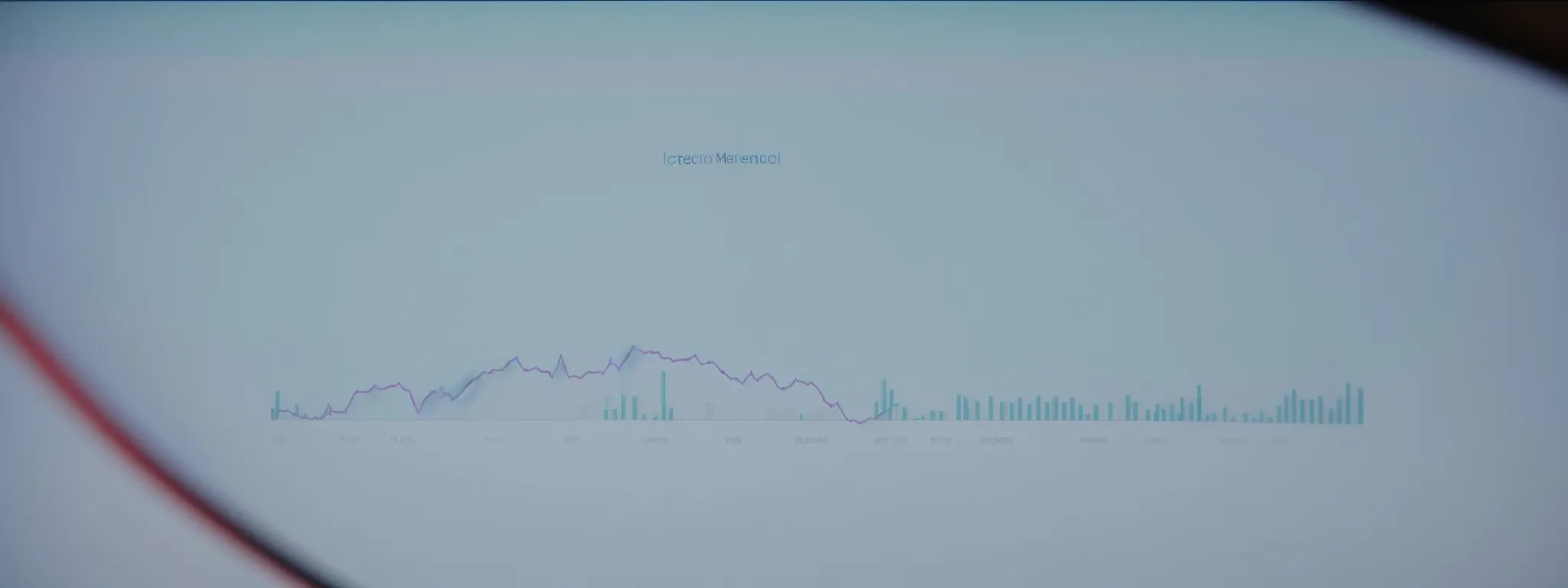 a glowing computer screen shows a graph with upward trending metrics next to a magnifying glass highlighting the word 