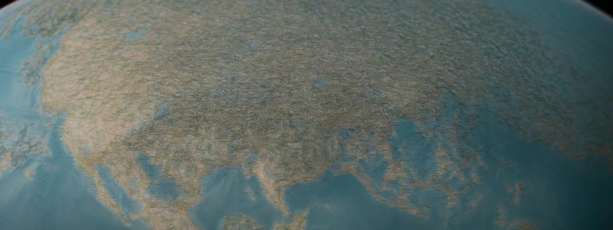 Close-up view of a physical world map showing Europe, the Middle East, and parts of Asia