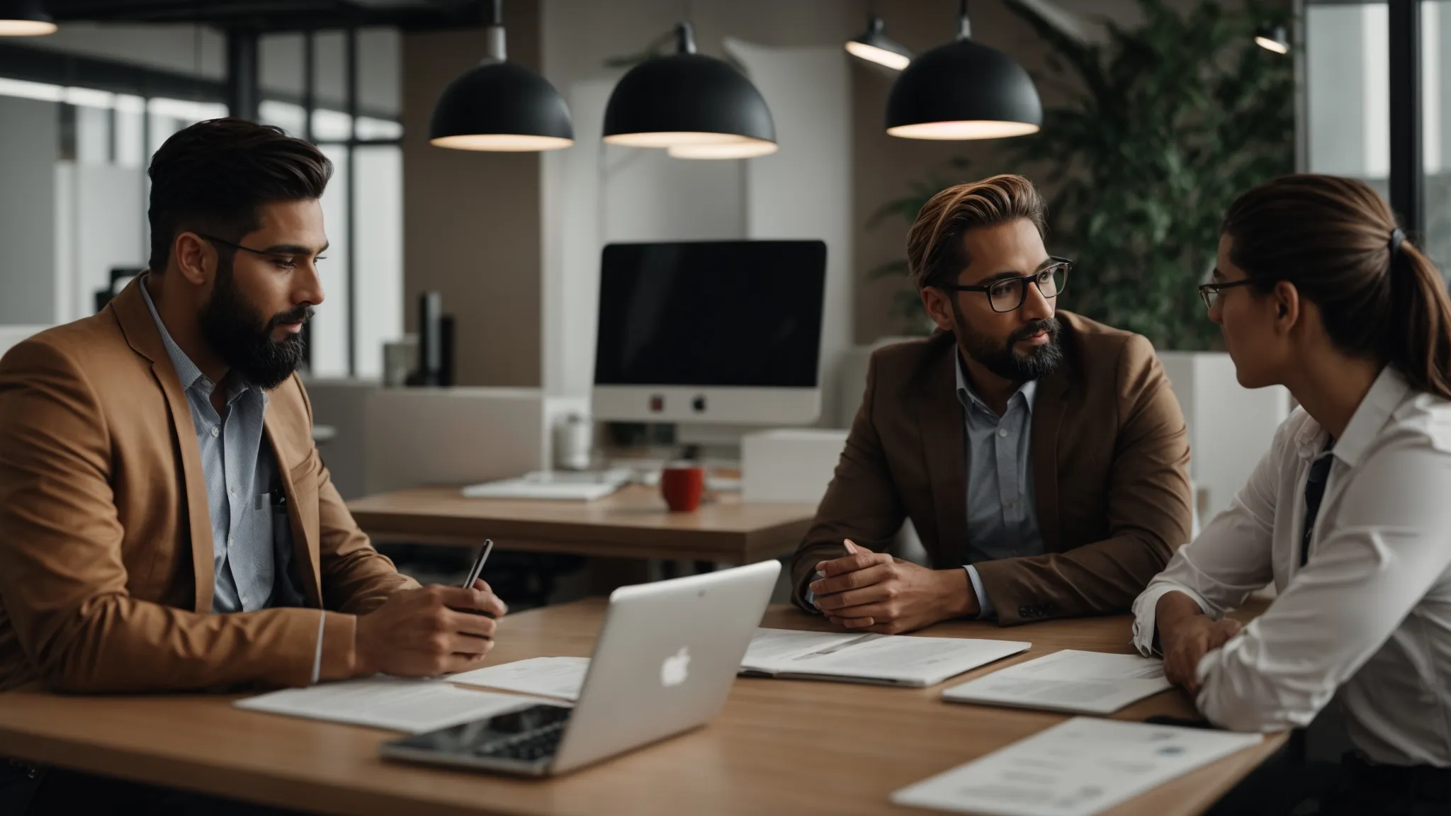 a professional meeting between a business owner and an seo expert in a modern office.