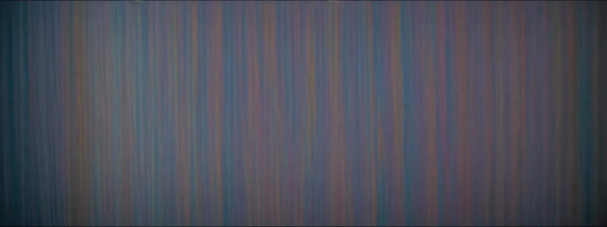 a lined array of colorful paint swatches under bright lighting, showcasing an array of hues.