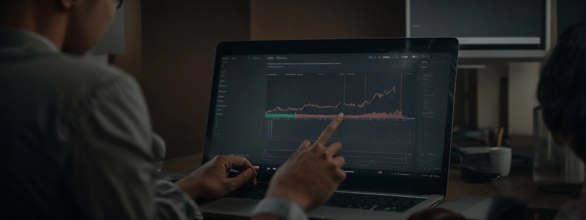 a marketer analyzing a graph showing increased conversions on a computer screen representing targeted landing page performance.