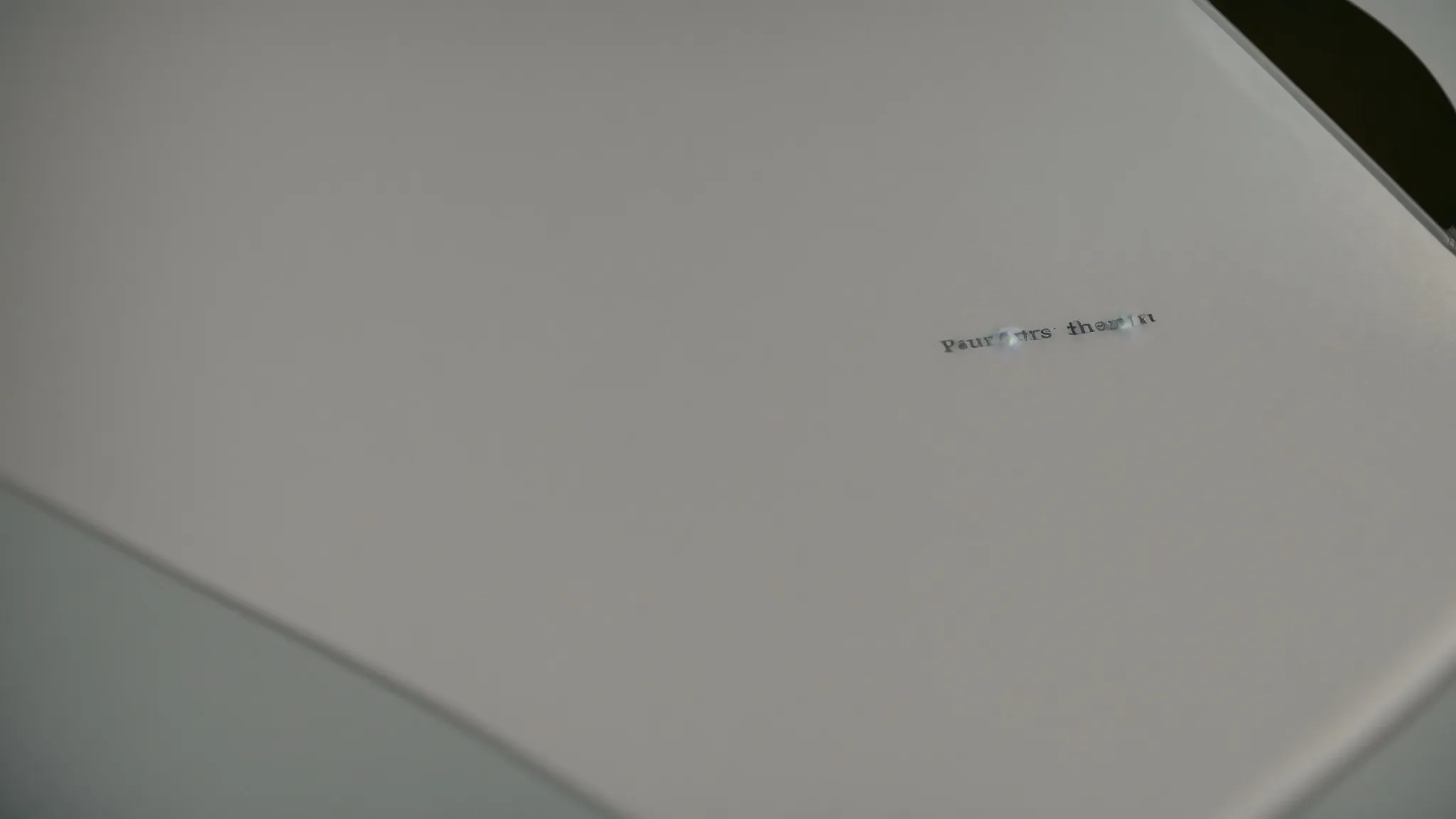 a magnifying glass revealing invisible text on a blank piece of paper.