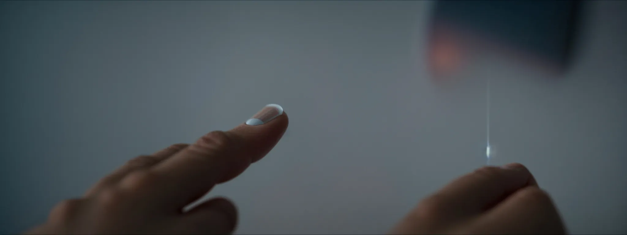 a person clicking on a brightly lit, enticing button on a touchscreen interface.