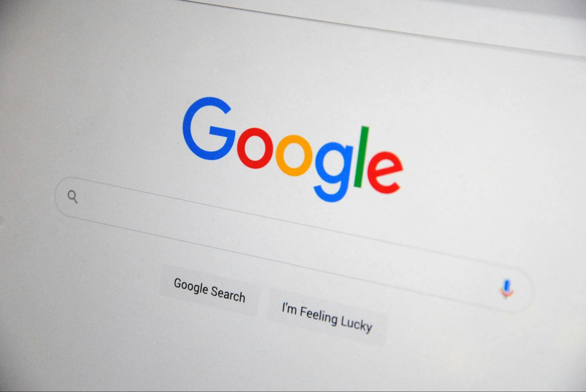 Close-up of Google search homepage with logo, search bar, and buttons for Google Search and I'm Feeling Lucky
